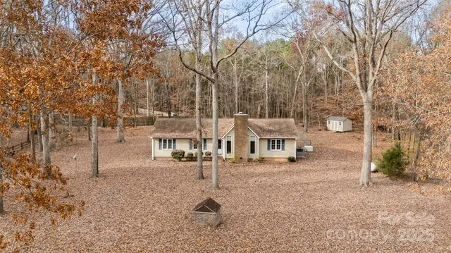 a row of houses with outdoor space and trees