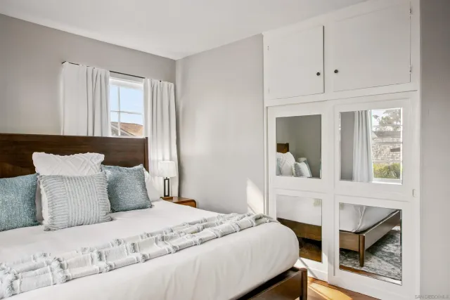 a bedroom with a bed and window