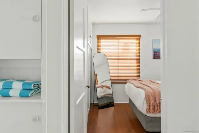 a bedroom with bed and a window