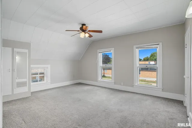 a view of empty room with windows