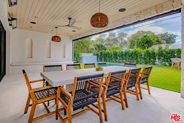 a view of balcony with wooden floor