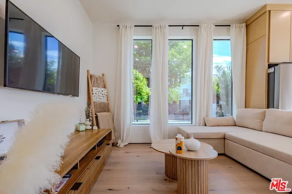 a view of a hallway with washer and dryer