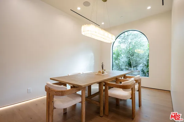 a kitchen with stainless steel appliances a refrigerator and a stove top oven
