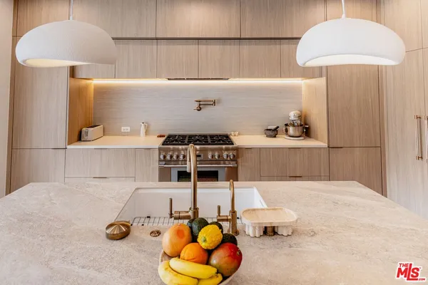 a living room with furniture a window and wooden floor