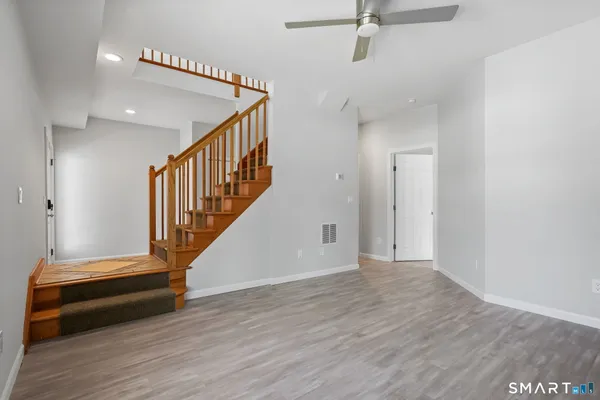a view of entryway with wooden floor