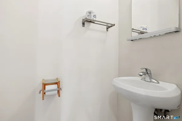 a bathroom with a sink and mirror