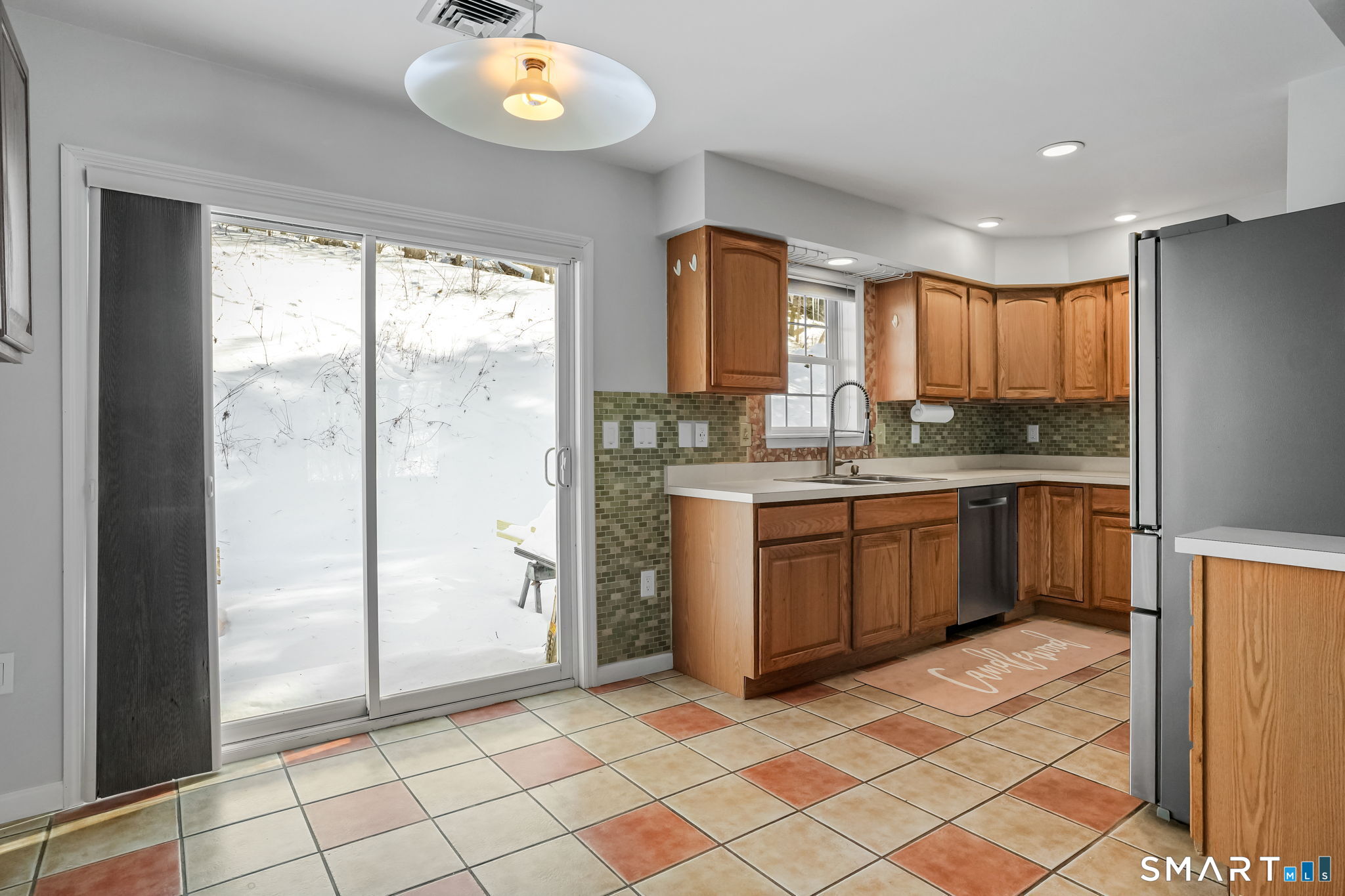 19 Candlewood Springs Road New Milford, CT 06776 - Photo 22 of 40 a kitchen with a sink a counter top space cabinets and stainless steel appliances