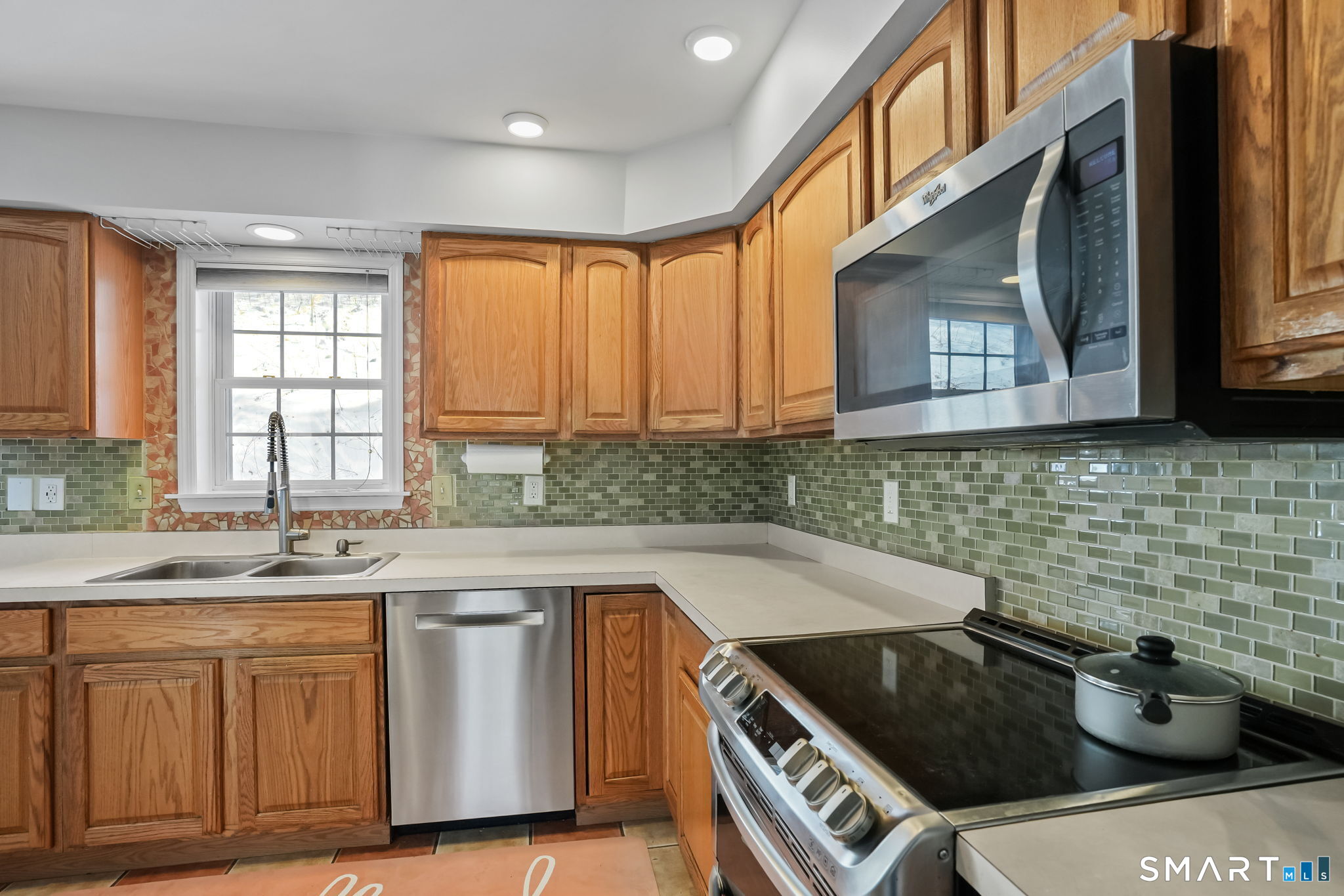 19 Candlewood Springs Road New Milford, CT 06776 - Photo 24 of 40 a kitchen that has a sink and a stove