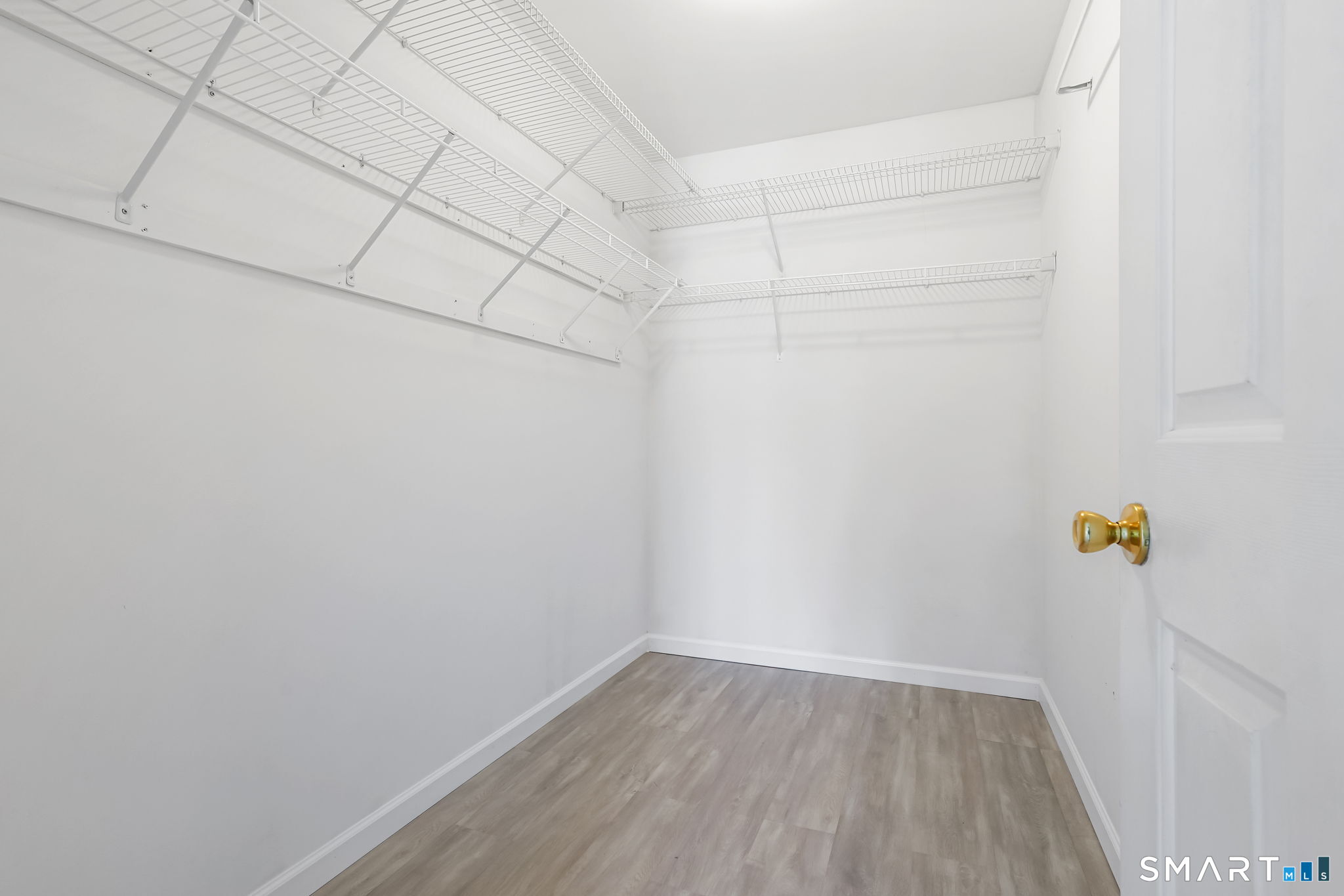 19 Candlewood Springs Road New Milford, CT 06776 - Photo 26 of 40 a view of a room with racks on the wall