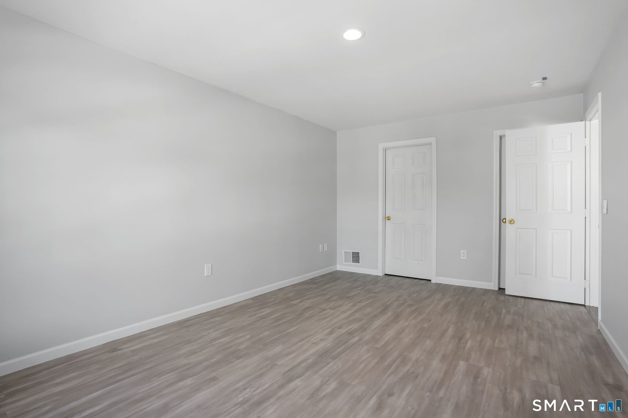 19 Candlewood Springs Road New Milford, CT 06776 - Photo 29 of 40 a view of an empty room with wooden floor