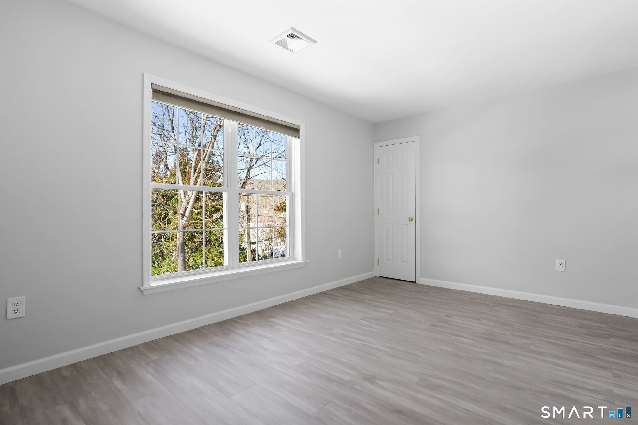19 Candlewood Springs Road New Milford, CT 06776 - Photo 31 of 40 an empty room with wooden floor and windows