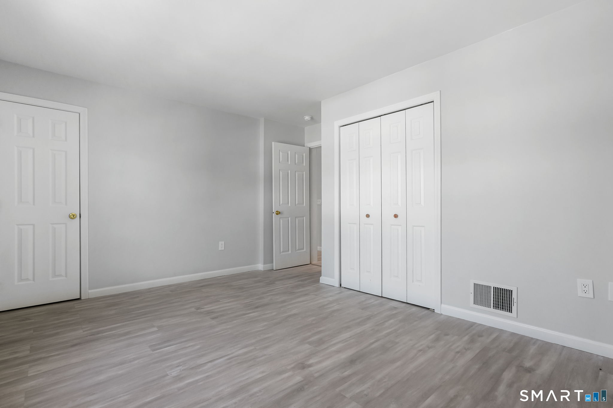 19 Candlewood Springs Road New Milford, CT 06776 - Photo 32 of 40 a view of an empty room with wooden floor