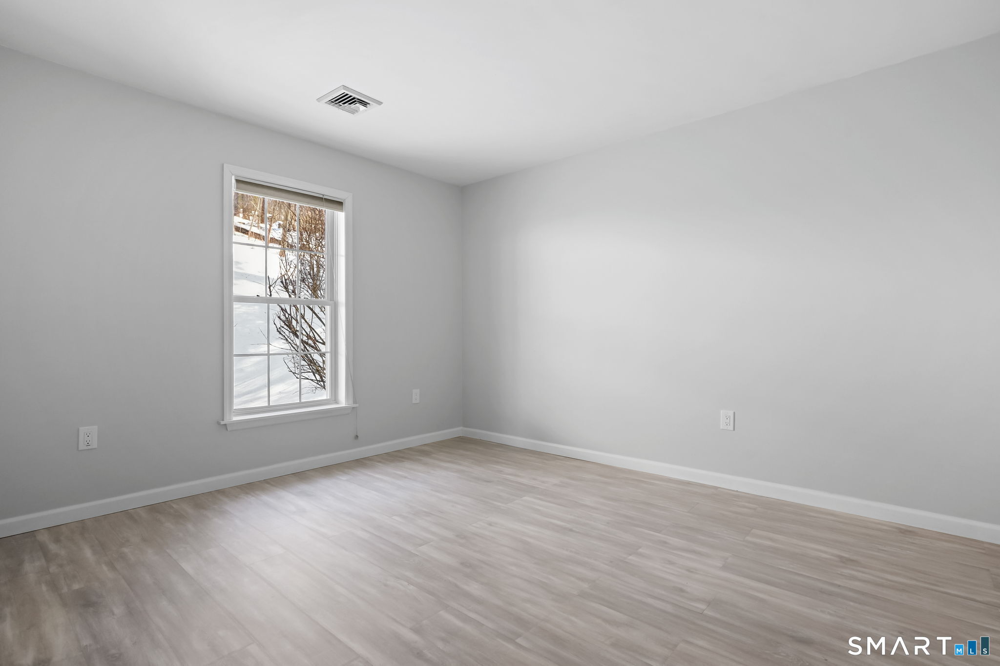 19 Candlewood Springs Road New Milford, CT 06776 - Photo 33 of 40 a view of an empty room with wooden floor and a window