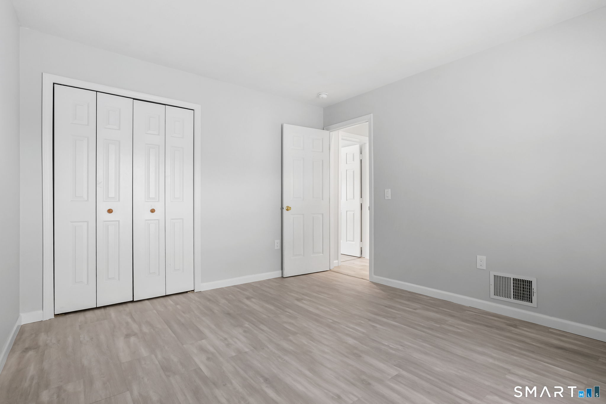 19 Candlewood Springs Road New Milford, CT 06776 - Photo 35 of 40 a view of an empty room with wooden floor