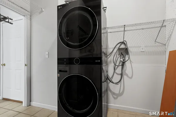 a close view of a utility room with dryer and washer