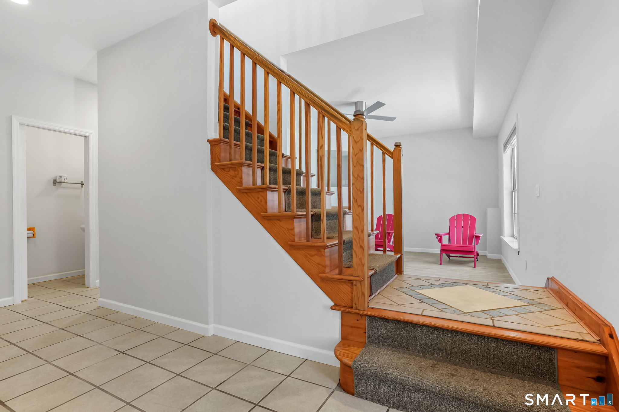19 Candlewood Springs Road New Milford, CT 06776 - Photo 8 of 40 a living room with stairs