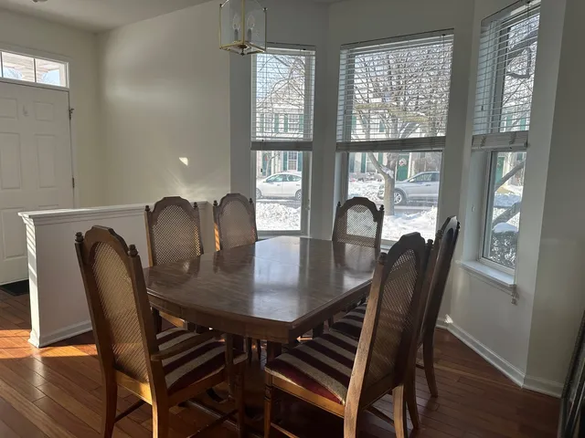 a view of a dining room with furniture and window