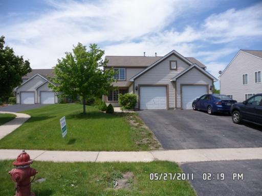 2873 Sorrel Row Lake In The Hills, IL 60156 - Photo 1 of 1 a front view of a house with a garden