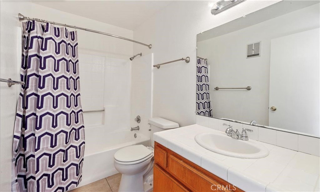 1108 Termino Avenue Long Beach, CA 90804 - Photo 16 of 22 a bathroom with a sink and a toilet