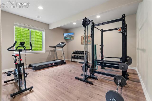 7880 Monarch Road Larkspur, CO 80118 - Photo 17 of 25 Workout area featuring hardwood / wood-style flooring