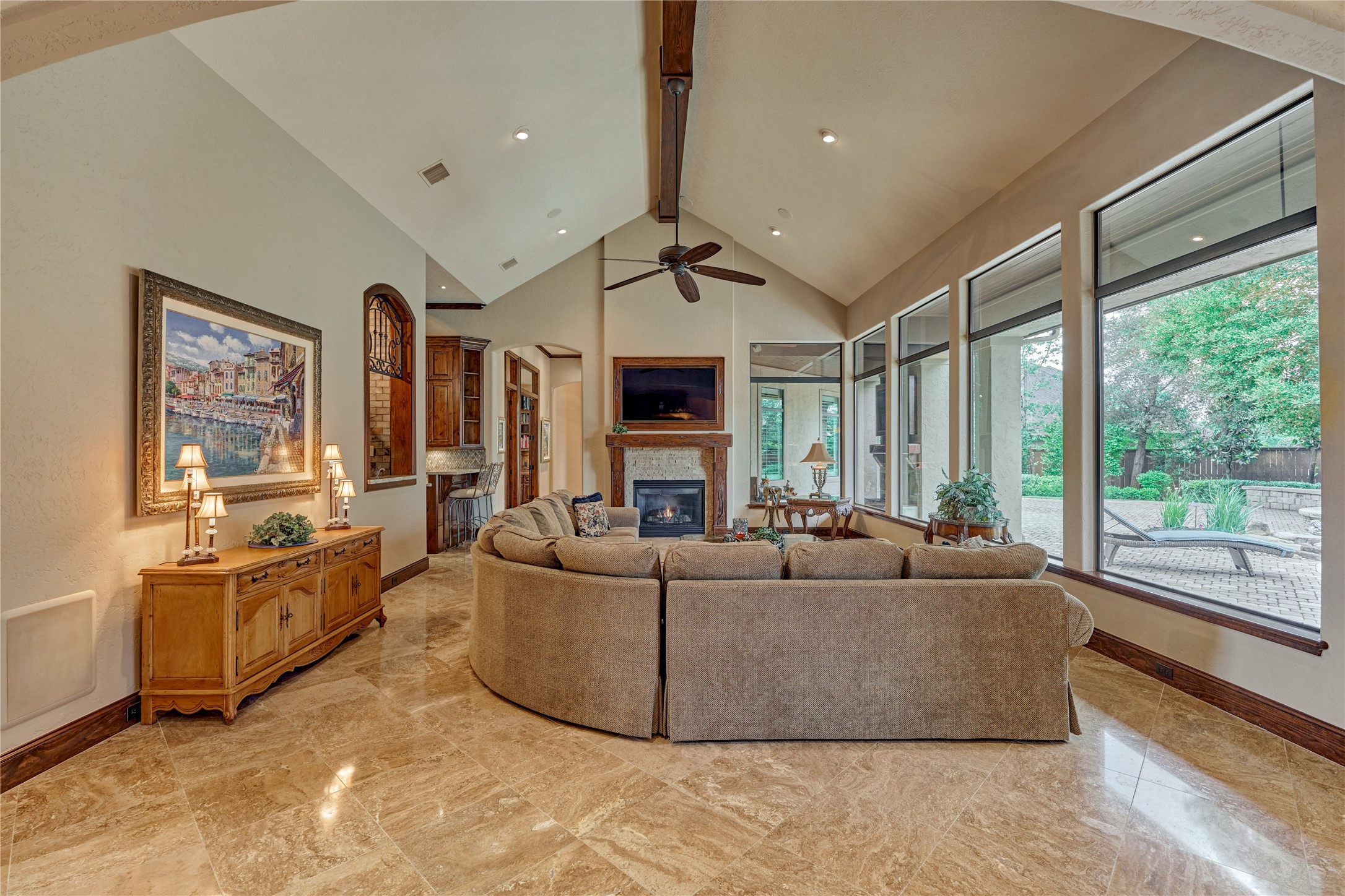 24803 Pearl Crest Lane Spring, TX 77389 - Photo 11 of 50 A vaulted cathedral ceiling opens this magnificent den, overlooking the outdoor living spaces—making it the perfect setting for indoor/outdoor entertaining.