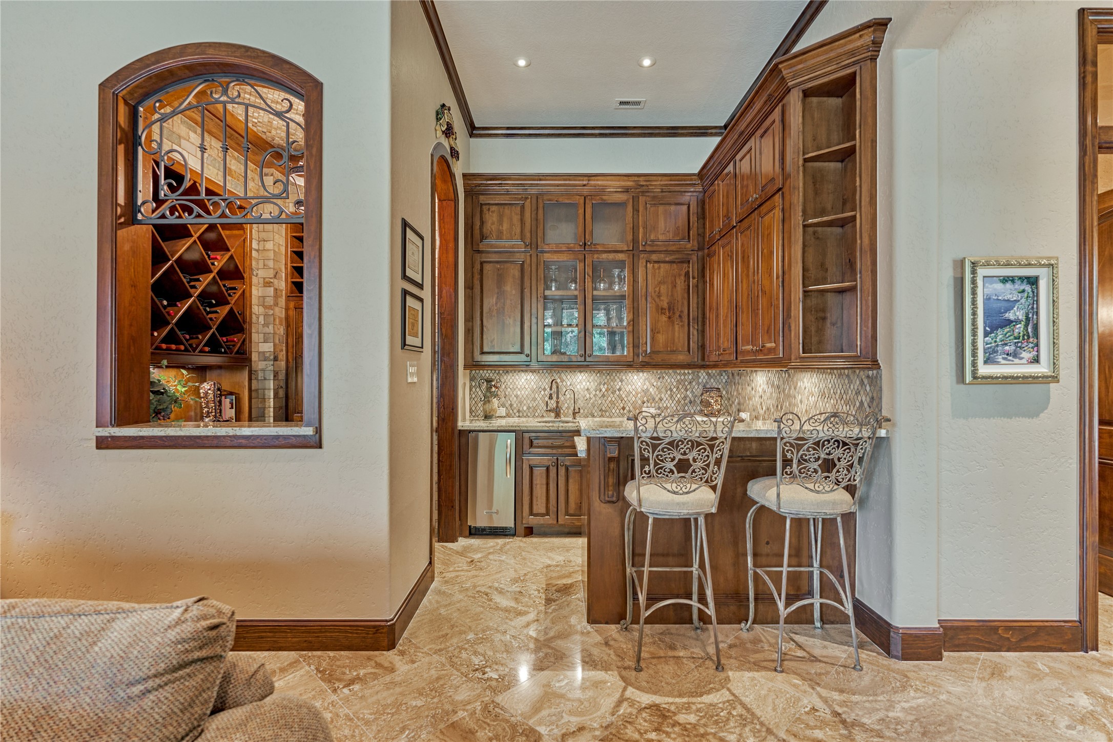 24803 Pearl Crest Lane Spring, TX 77389 - Photo 14 of 50 Wet bar with bar top seating and wine room elegantly adjoins the Den.