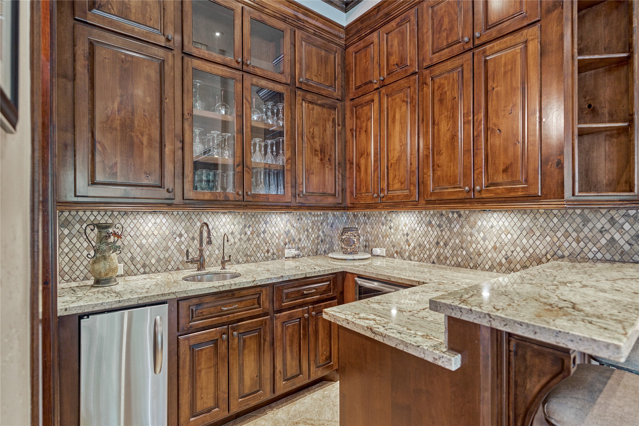 24803 Pearl Crest Lane Spring, TX 77389 - Photo 15 of 50 Beautifully appointed wet bar includes a refrigerator, ice maker, and stainless steel sink.