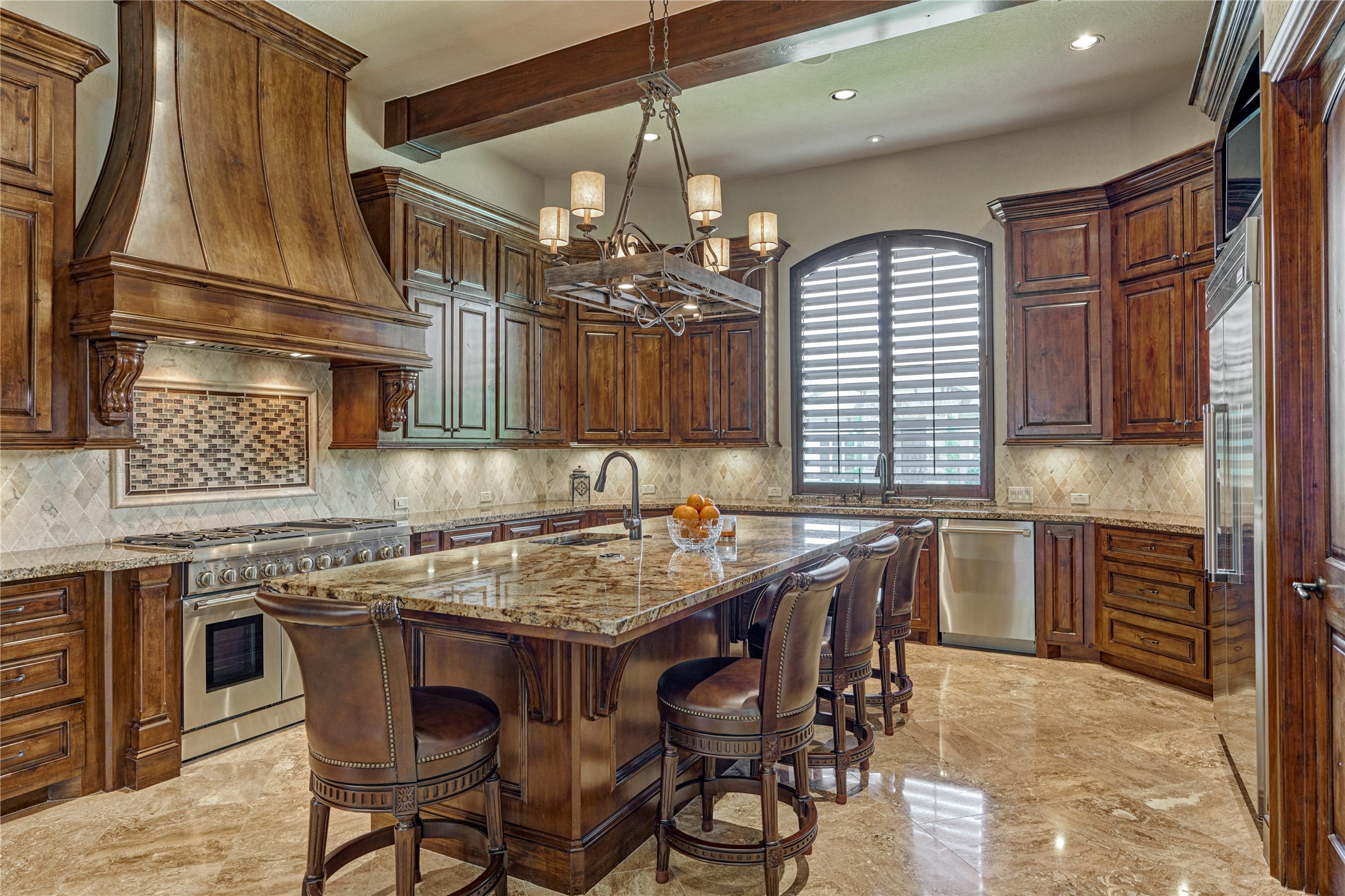 24803 Pearl Crest Lane Spring, TX 77389 - Photo 19 of 50 Gourmet, chef-inspired kitchen with large island and stunning architectural features.