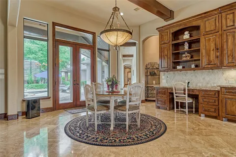 a spacious bathroom with a granite countertop sink a toilet and shower
