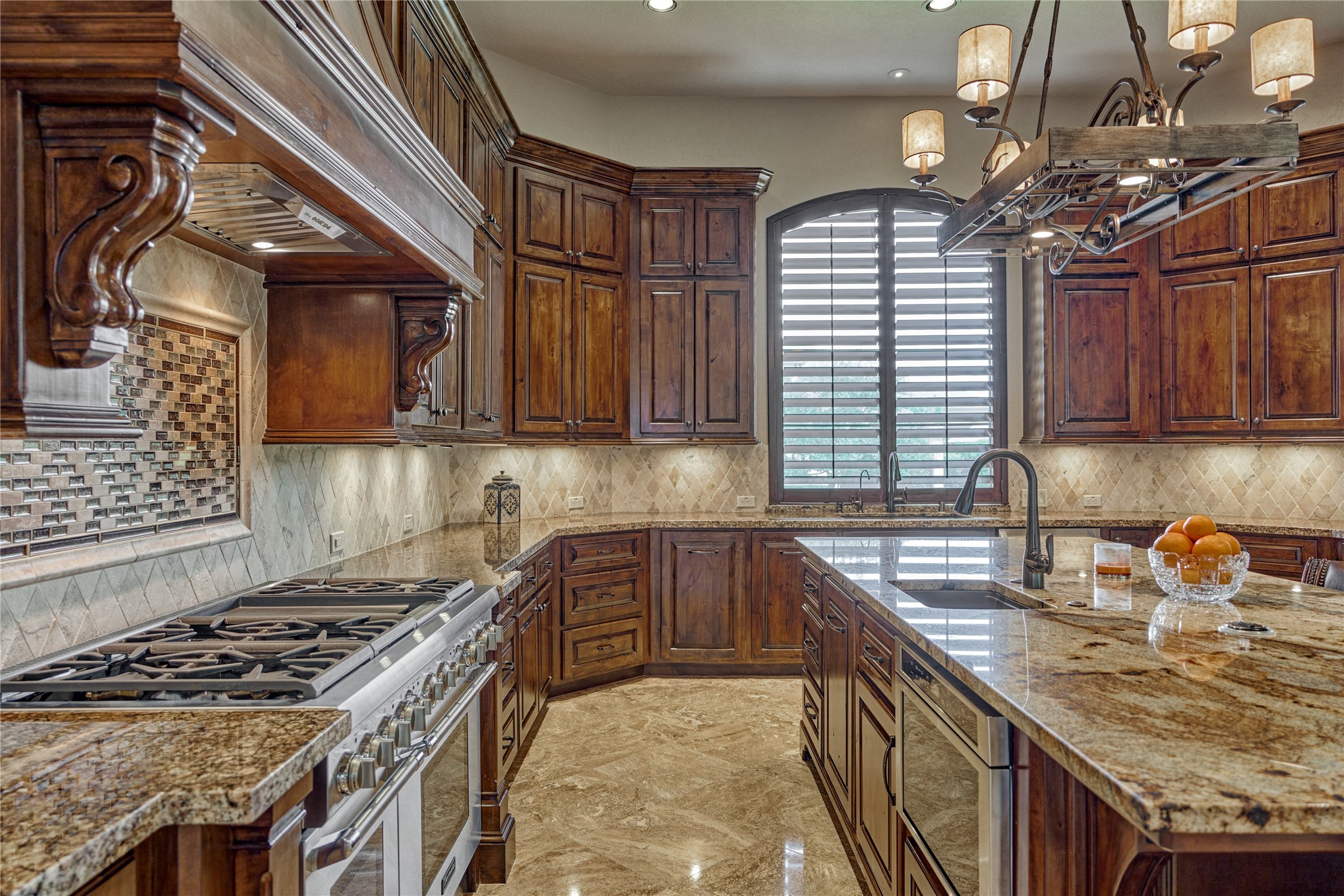 24803 Pearl Crest Lane Spring, TX 77389 - Photo 20 of 50 Showcasing a Thermador appliance package and a 48" range, this kitchen is a chef’s dream—offering exceptional workspace and organization.