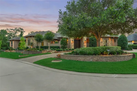 a view of house with outdoor space and garden