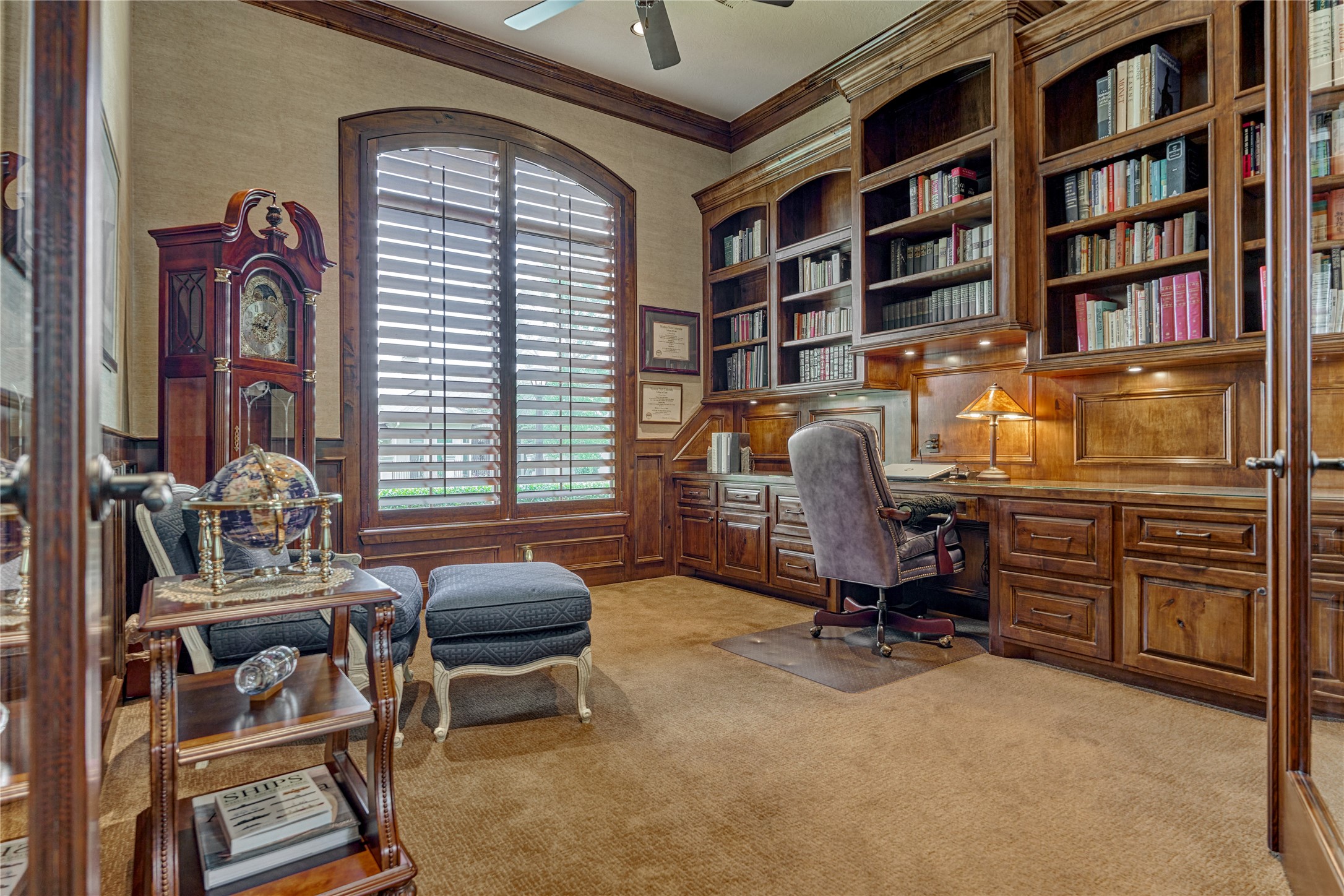 24803 Pearl Crest Lane Spring, TX 77389 - Photo 22 of 50 Handsome home office with rich wood accents, plantation shutters, and a wall of built-ins.
