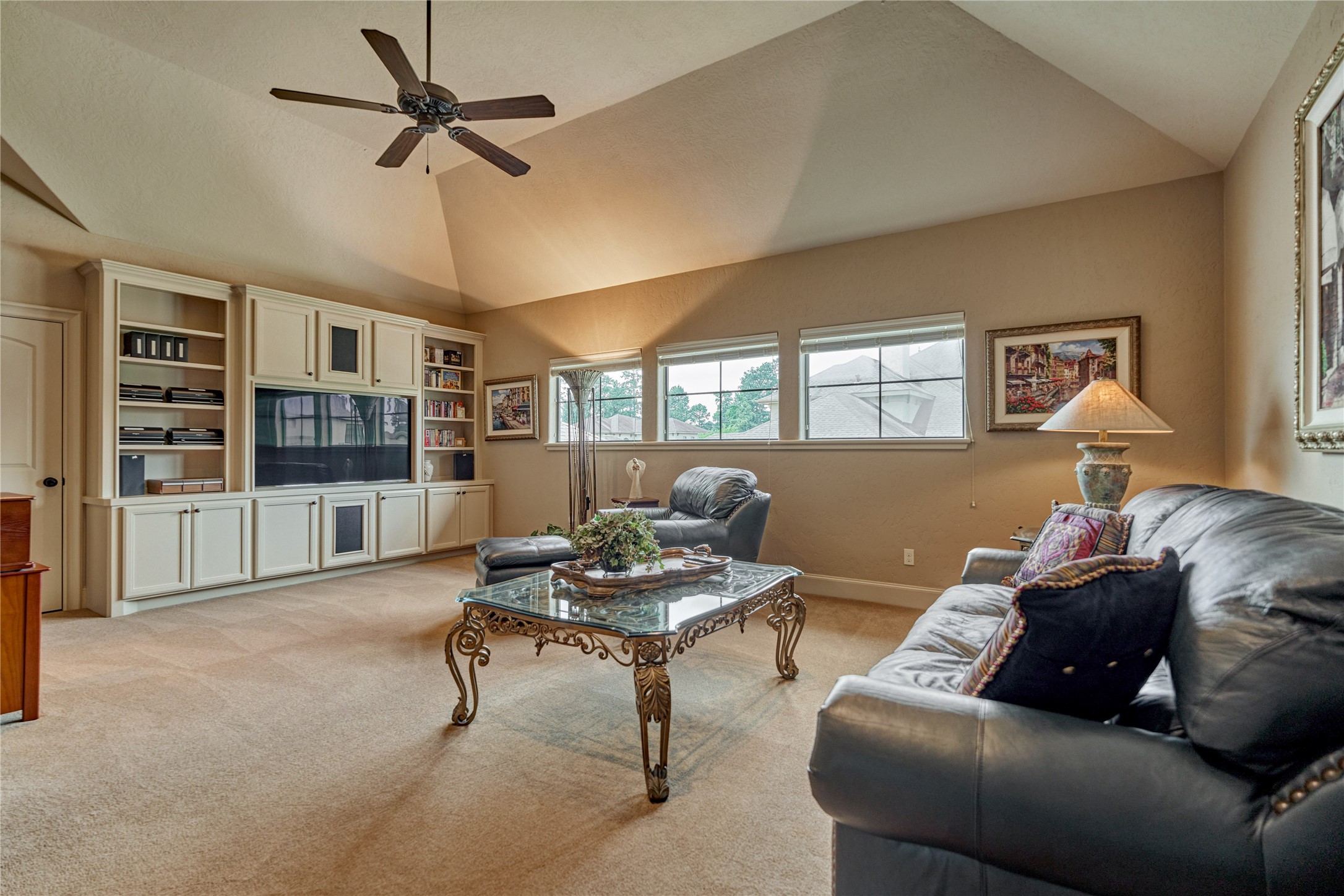 24803 Pearl Crest Lane Spring, TX 77389 - Photo 38 of 50 Upstairs game room is a versatile living space with a wall of built-ins and walk-in attic access.