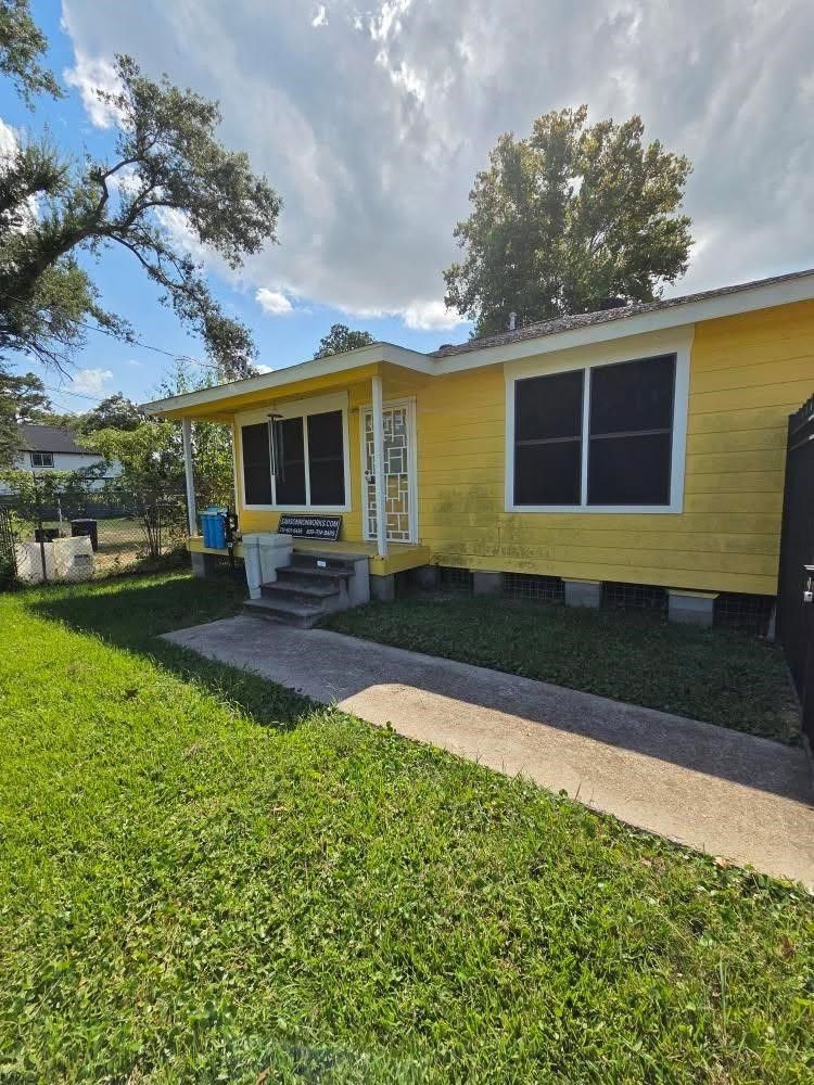 a front view of house with yard and outdoor seating