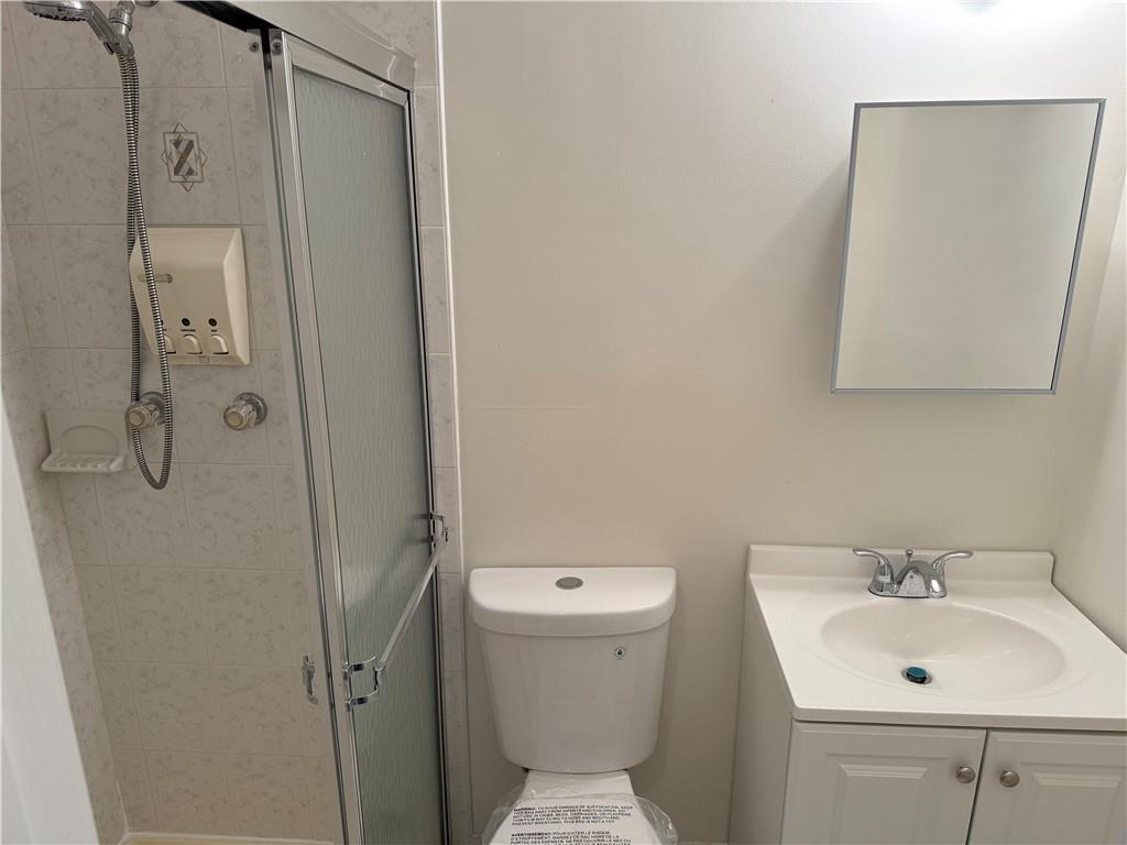 7 Georgetown Lane Brooklyn, NY 11234 - Photo 20 of 32 a bathroom with a sink a toilet and shower