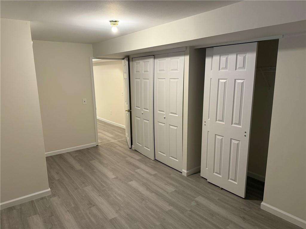 7 Georgetown Lane Brooklyn, NY 11234 - Photo 24 of 32 an empty room with wooden floor & closet area