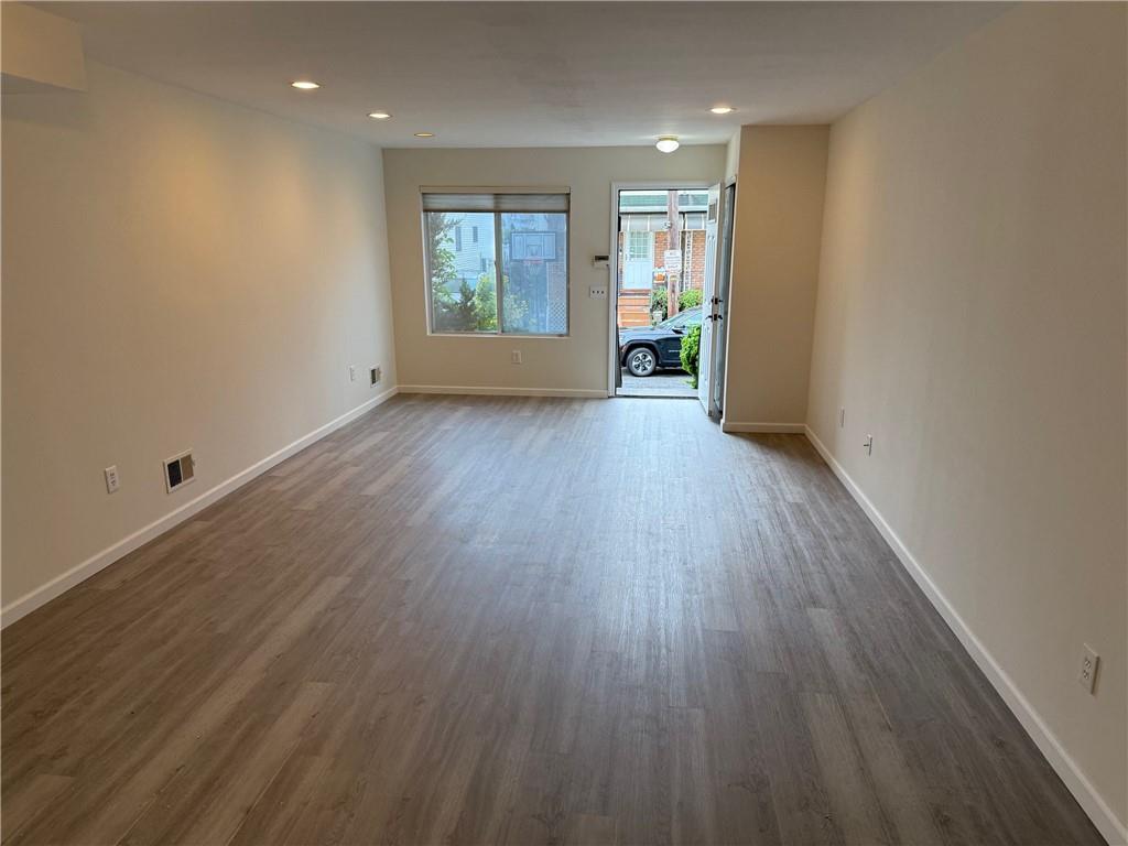 7 Georgetown Lane Brooklyn, NY 11234 - Photo 3 of 32 wooden floor in an empty room with a window