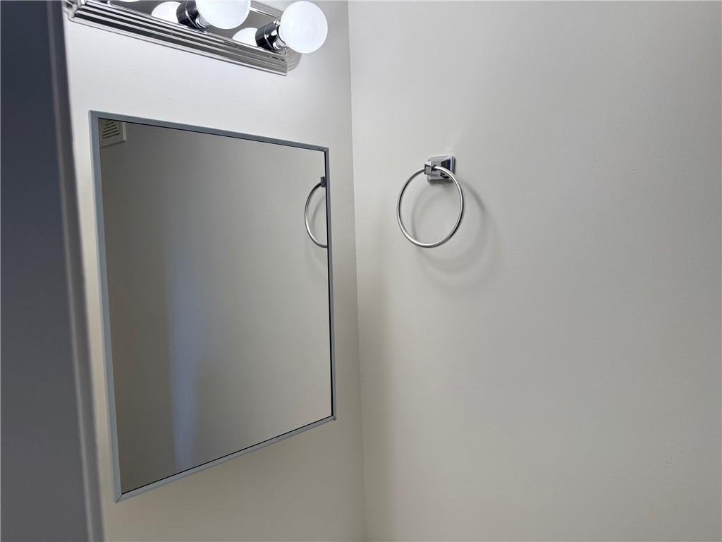 7 Georgetown Lane Brooklyn, NY 11234 - Photo 5 of 32 a bathroom with a glass shower door