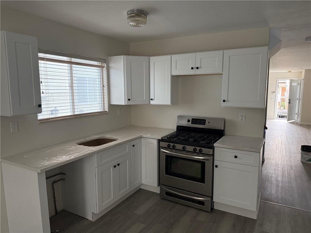 7 Georgetown Lane Brooklyn, NY 11234 - Photo 6 of 32 a kitchen with cabinets appliances and a window