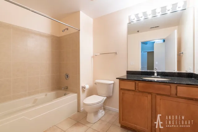 a bathroom with a toilet a sink and a bathtub