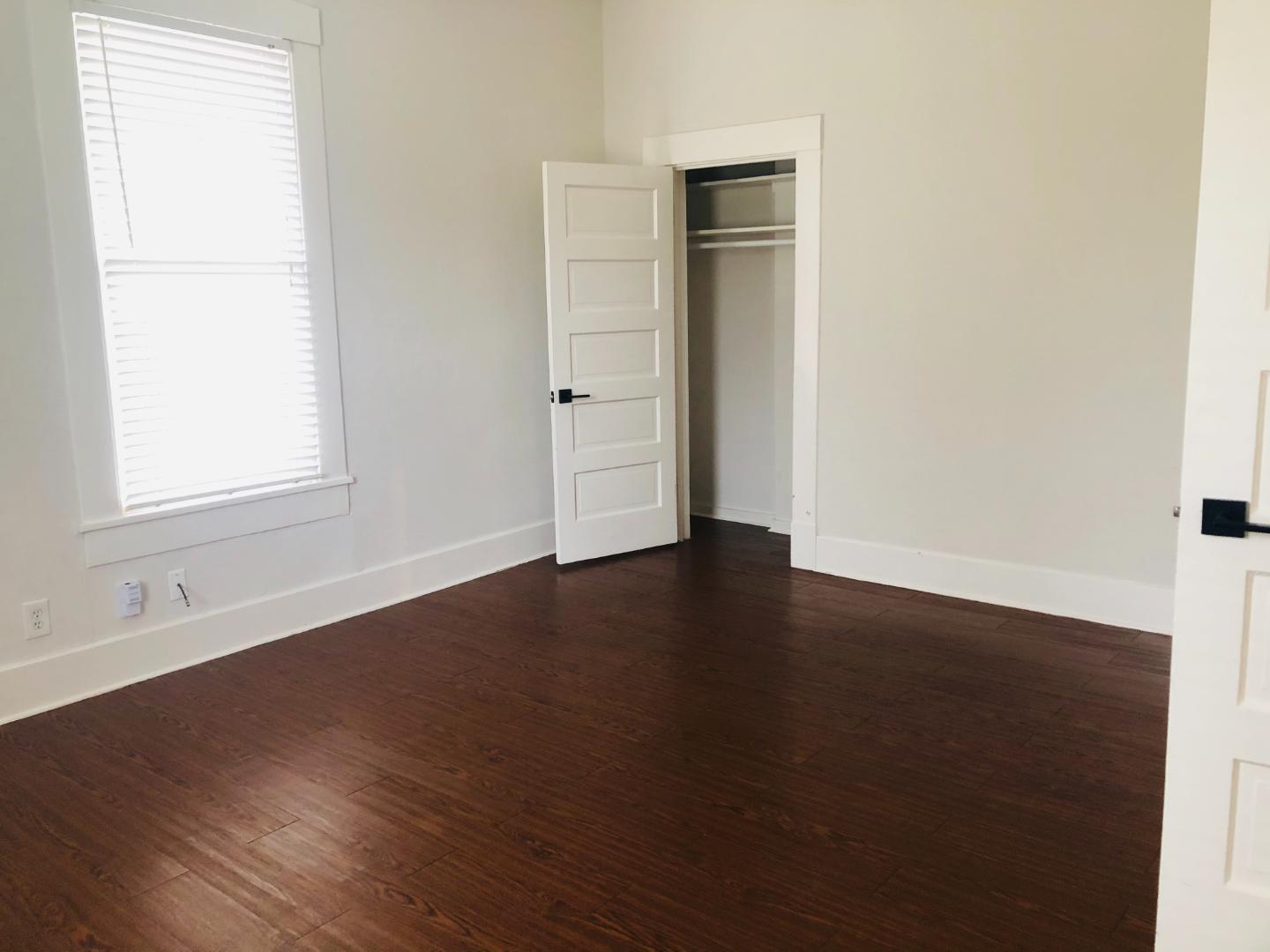 207 West 39th Street, Unit MAIN Austin, TX 78751 - Photo 4 of 7 Rich hardwood flooring grounds this versatile room, ready for your personalized touch.