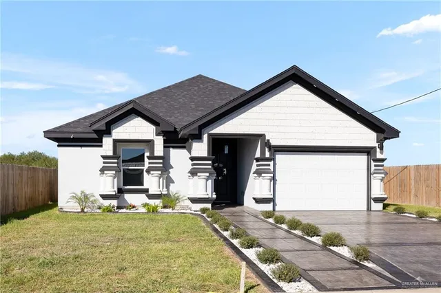 a front view of house with garage