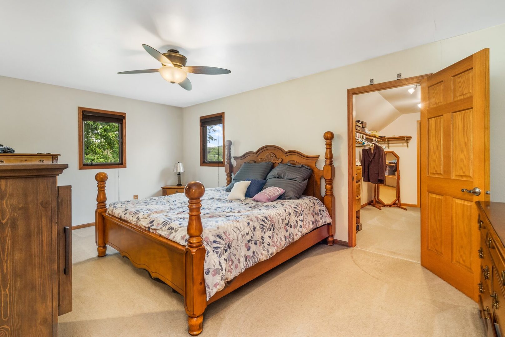 25123 South Chicago Road Elwood, IL 60421 - Photo 21 of 42 a bedroom with a bed and a chandelier