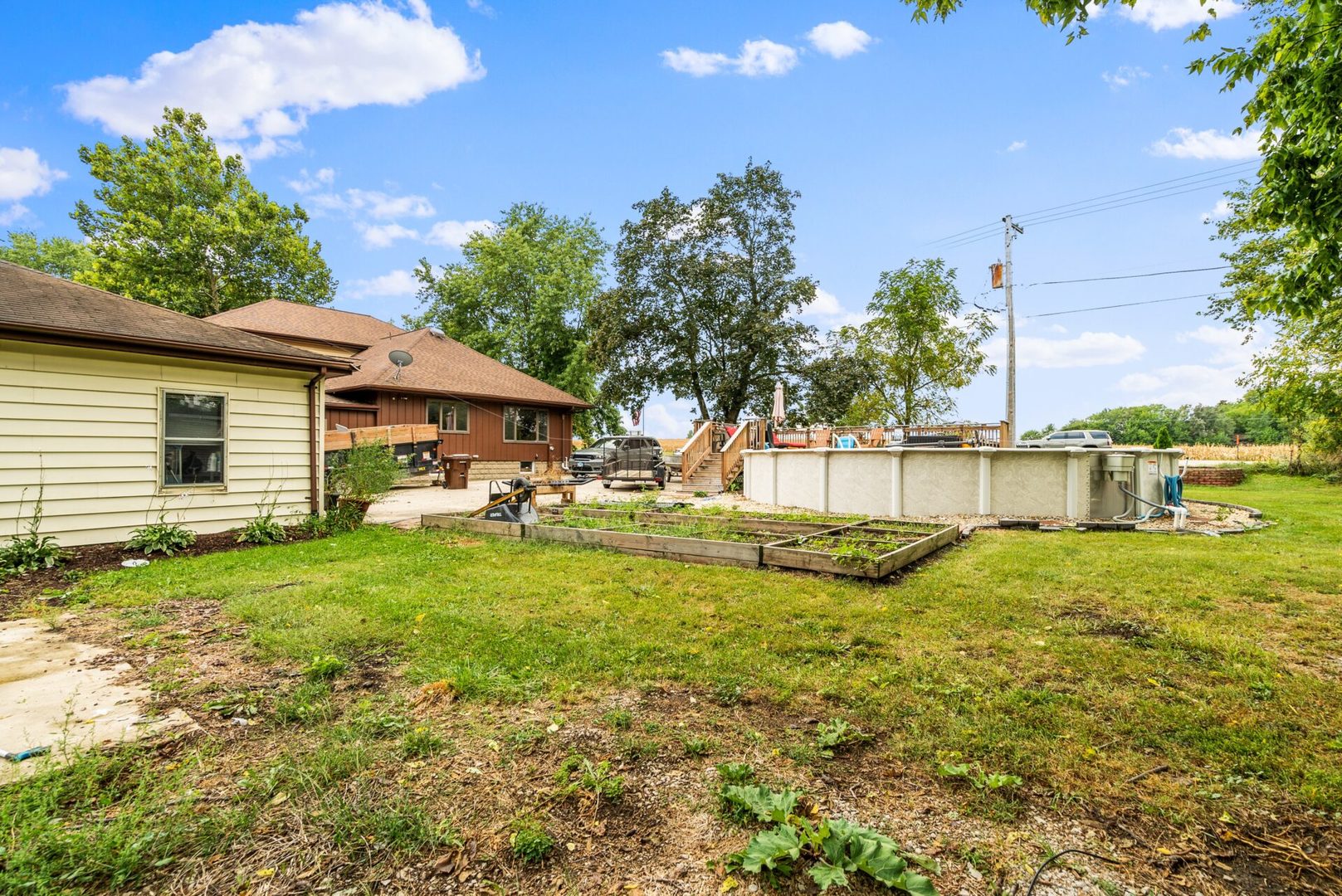 25123 South Chicago Road Elwood, IL 60421 - Photo 31 of 42 a view of a house with a yard patio and swimming pool