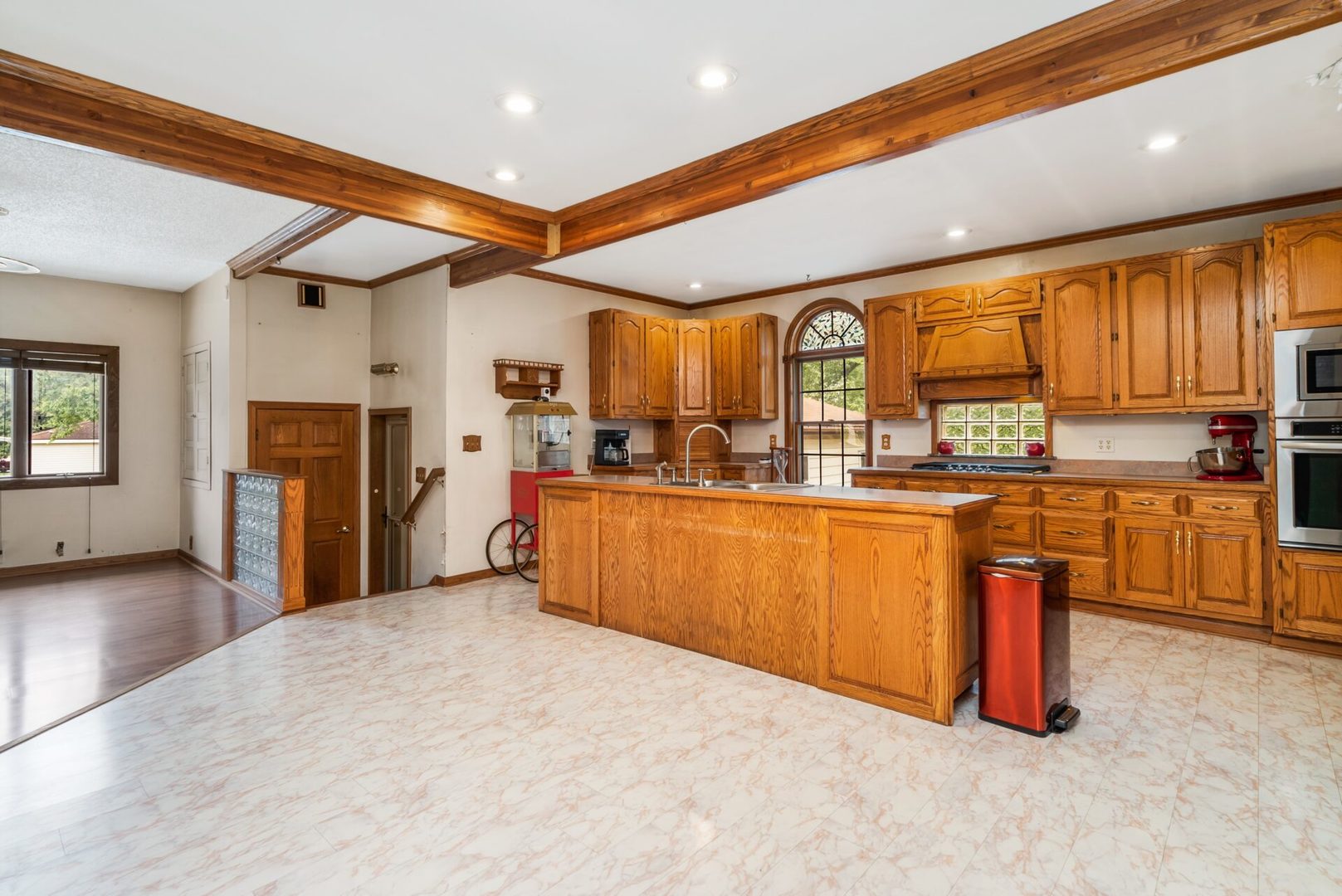 25123 South Chicago Road Elwood, IL 60421 - Photo 7 of 42 a kitchen with stainless steel appliances granite countertop a refrigerator a sink dishwasher and a fireplace with wooden floor