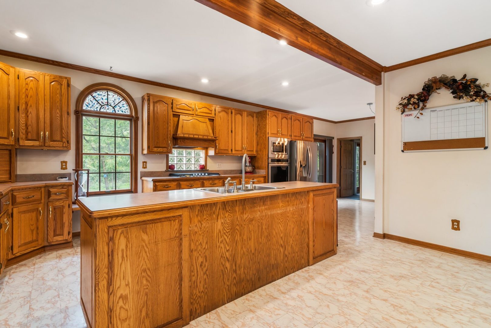 25123 South Chicago Road Elwood, IL 60421 - Photo 9 of 42 a large kitchen with stainless steel appliances granite countertop a refrigerator a stove and a sink with cabinets