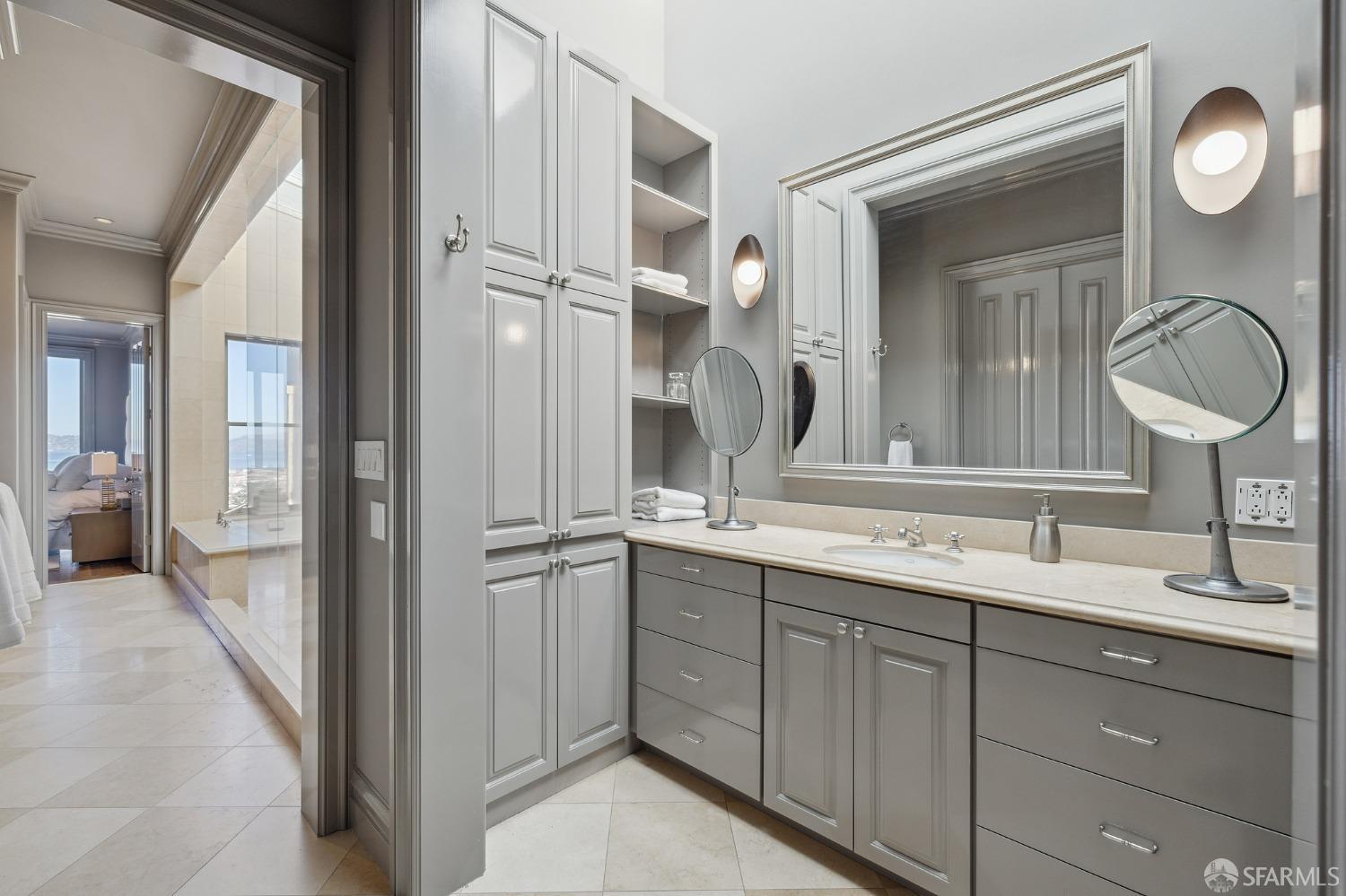 2480 Broadway San Francisco, CA 94115 - Photo 36 of 70 a bathroom with a double vanity sink and a mirror