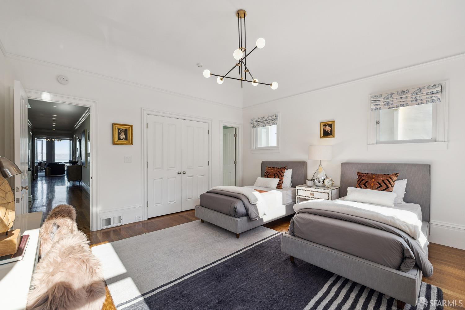 2480 Broadway San Francisco, CA 94115 - Photo 38 of 70 a bedroom with furniture and a chandelier