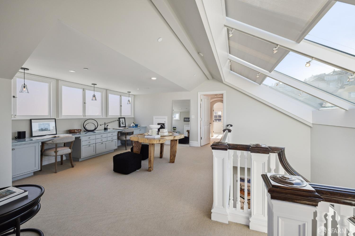2480 Broadway San Francisco, CA 94115 - Photo 57 of 70 a open kitchen with stainless steel appliances kitchen island granite countertop a sink and dishwasher a stove top oven with wooden floor