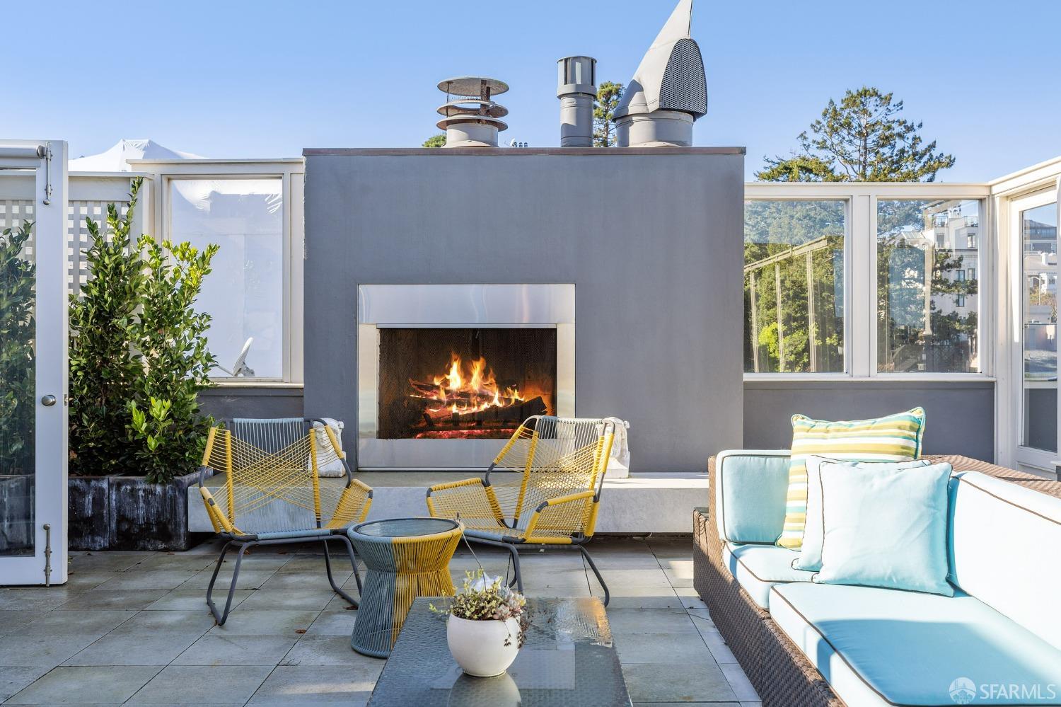 2480 Broadway San Francisco, CA 94115 - Photo 64 of 70 a living room with furniture a chandelier and a fireplace